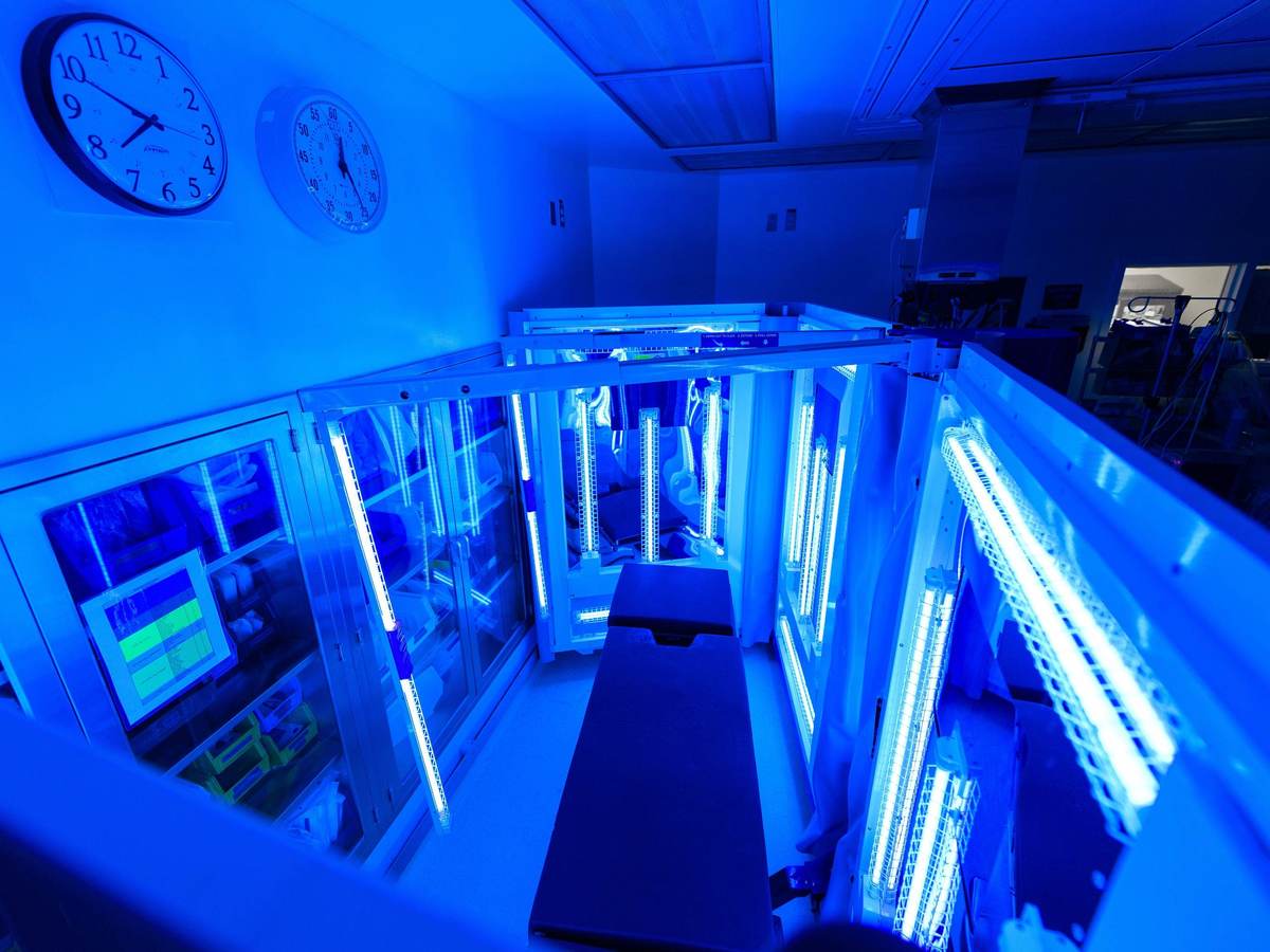 Hospital examination table being treated with UV light for sterilization